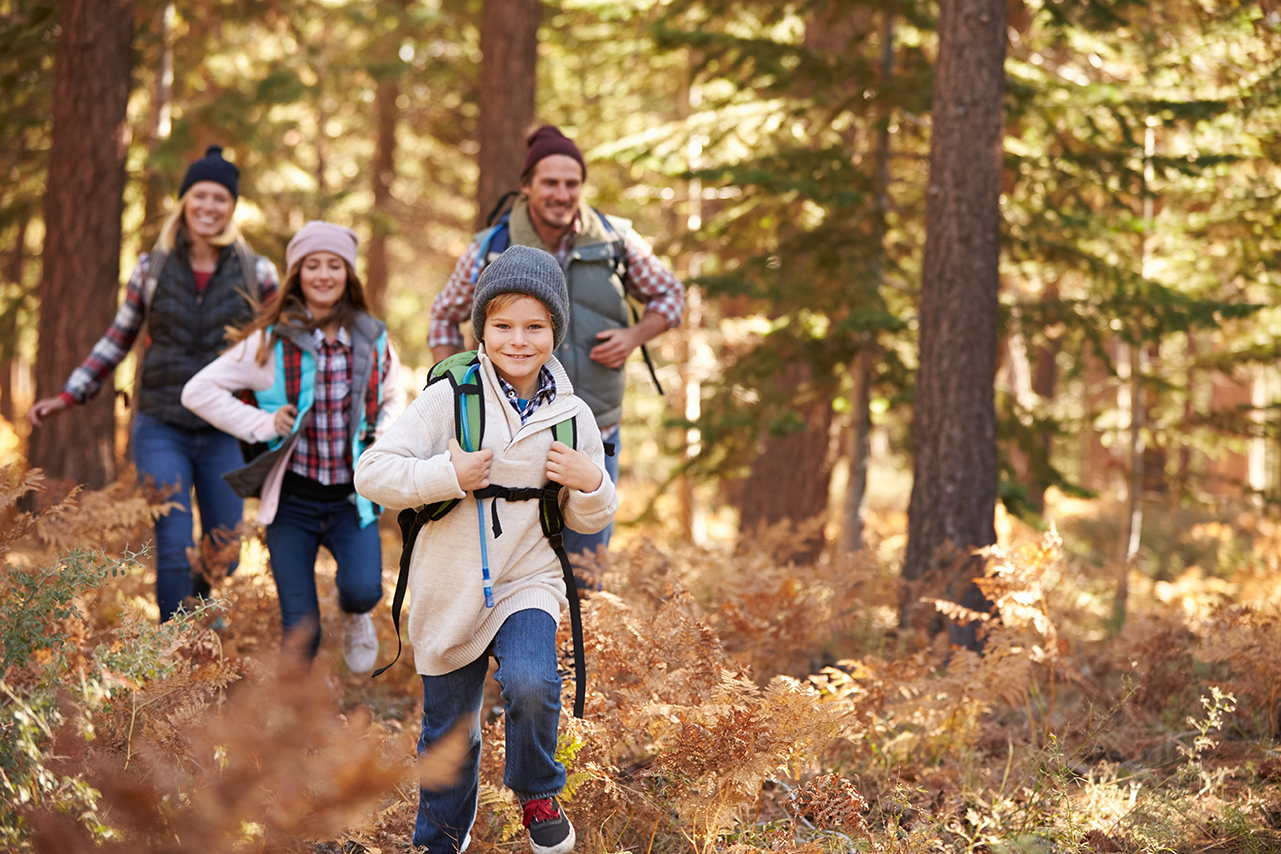 Familyhiking.jpg shows a family hiking through a forest