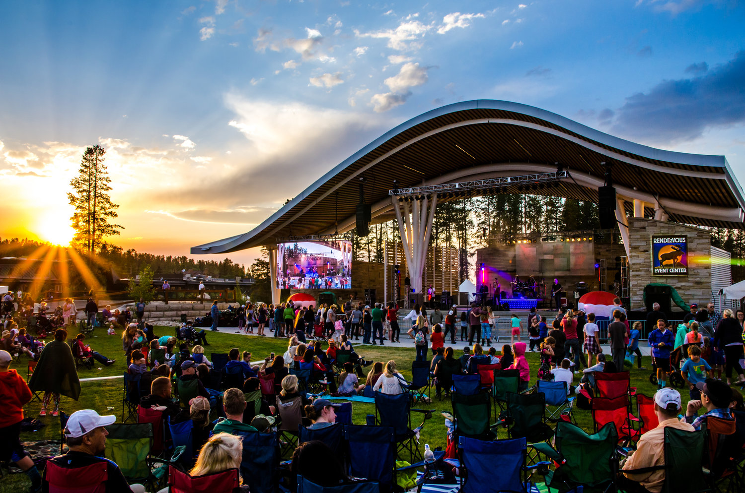 Rendevous Event Center outdoor concert with crowd at sunset
